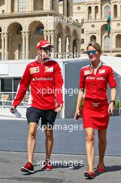 Sebastian Vettel (GER) Ferrari with Britta Roeske (AUT) Ferrari Press Officer. 16.06.2016. Formula 1 World Championship, Rd 8, European Grand Prix, Baku Street Circuit, Azerbaijan, Preparation Day.
