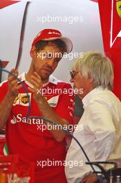 (L to R): Sebastian Vettel (GER) Ferrari with Bernie Ecclestone (GBR). 16.06.2016. Formula 1 World Championship, Rd 8, European Grand Prix, Baku Street Circuit, Azerbaijan, Preparation Day.