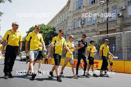 Kevin Magnussen (DEN) Renault Sport F1 Team and Esteban Ocon (FRA) Renault Sport F1 Team Test Driver walk the circuit with the team. 16.06.2016. Formula 1 World Championship, Rd 8, European Grand Prix, Baku Street Circuit, Azerbaijan, Preparation Day.