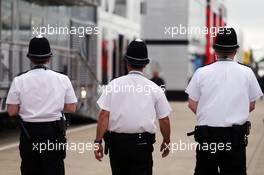 Police in the paddock. 08.07.2016. Formula 1 World Championship, Rd 10, British Grand Prix, Silverstone, England, Practice Day.