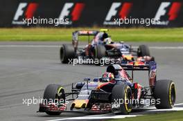 Daniil Kvyat (RUS) Scuderia Toro Rosso STR11 leads team mate Carlos Sainz Jr (ESP) Scuderia Toro Rosso STR11. 08.07.2016. Formula 1 World Championship, Rd 10, British Grand Prix, Silverstone, England, Practice Day.