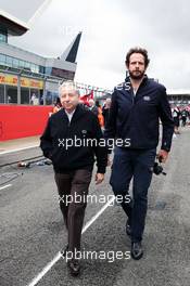 Jean Todt (FRA) FIA President on the grid with Matteo Bonciani (ITA) FIA Media Delegate. 10.07.2016. Formula 1 World Championship, Rd 10, British Grand Prix, Silverstone, England, Race Day.