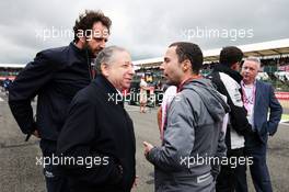 Jean Todt (FRA) FIA President on the grid with Matteo Bonciani (ITA) FIA Media Delegate and Nicolas Todt (FRA) Driver Manager. 10.07.2016. Formula 1 World Championship, Rd 10, British Grand Prix, Silverstone, England, Race Day.
