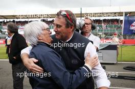 (L to R): Bernie Ecclestone (GBR) with Nigel Mansell (GBR) FIA Steward on the grid. 10.07.2016. Formula 1 World Championship, Rd 10, British Grand Prix, Silverstone, England, Race Day.