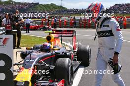 Jenson Button (GBR) McLaren with Max Verstappen (NLD) Red Bull Racing RB12 in parc ferme. 10.07.2016. Formula 1 World Championship, Rd 10, British Grand Prix, Silverstone, England, Race Day.