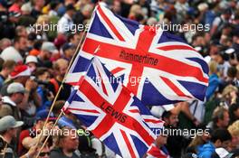 Fans at the podium with flags for Lewis Hamilton (GBR) Mercedes AMG F1. 10.07.2016. Formula 1 World Championship, Rd 10, British Grand Prix, Silverstone, England, Race Day.