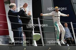 Race winner Lewis Hamilton (GBR) Mercedes AMG F1 celebrates on the podium. 10.07.2016. Formula 1 World Championship, Rd 10, British Grand Prix, Silverstone, England, Race Day.