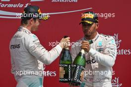 The podium (L to R): Nico Rosberg (GER) Mercedes AMG F1 celebrates his second position with team mate and race winner Lewis Hamilton (GBR) Mercedes AMG F1. 10.07.2016. Formula 1 World Championship, Rd 10, British Grand Prix, Silverstone, England, Race Day.