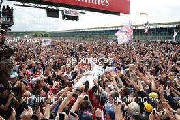 Race winner Lewis Hamilton (GBR) Mercedes AMG F1 celebrates with the fans. 10.07.2016. Formula 1 World Championship, Rd 10, British Grand Prix, Silverstone, England, Race Day.