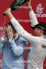Nico Rosberg (GER) Mercedes AMG F1 celebrates his second position with the champagne on the podium. 10.07.2016. Formula 1 World Championship, Rd 10, British Grand Prix, Silverstone, England, Race Day.