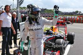 Nico Rosberg (GER) Mercedes AMG F1 with Max Verstappen (NLD) Red Bull Racing in parc ferme. 10.07.2016. Formula 1 World Championship, Rd 10, British Grand Prix, Silverstone, England, Race Day.