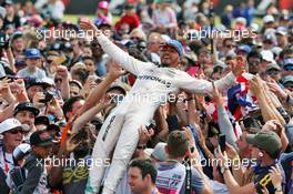 Race winner Lewis Hamilton (GBR) Mercedes AMG F1 celebrates with the fans. 10.07.2016. Formula 1 World Championship, Rd 10, British Grand Prix, Silverstone, England, Race Day.