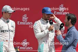 The podium (L to R): Nico Rosberg (GER) Mercedes AMG F1 with race winner Lewis Hamilton (GBR) Mercedes AMG F1 and Mark Webber (AUS) Porsche Team WEC Driver / Channel 4 Presenter. 10.07.2016. Formula 1 World Championship, Rd 10, British Grand Prix, Silverstone, England, Race Day.