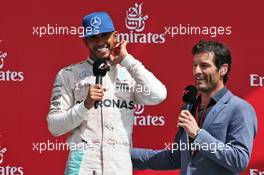 The podium (L to R): race winner Lewis Hamilton (GBR) Mercedes AMG F1 with Mark Webber (AUS) Porsche Team WEC Driver / Channel 4 Presenter. 10.07.2016. Formula 1 World Championship, Rd 10, British Grand Prix, Silverstone, England, Race Day.