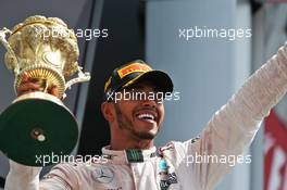 Race winner Lewis Hamilton (GBR) Mercedes AMG F1 celebrates on the podium. 10.07.2016. Formula 1 World Championship, Rd 10, British Grand Prix, Silverstone, England, Race Day.