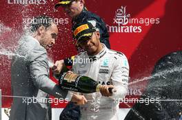 Race winner Lewis Hamilton (GBR) Mercedes AMG F1 celebrates with the champagne on the podium. 10.07.2016. Formula 1 World Championship, Rd 10, British Grand Prix, Silverstone, England, Race Day.