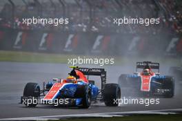Rio Haryanto (IDN) Manor Racing MRT05 leads team mate Pascal Wehrlein (GER) Manor Racing MRT05. 10.07.2016. Formula 1 World Championship, Rd 10, British Grand Prix, Silverstone, England, Race Day.