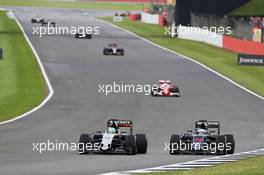 Nico Hulkenberg (GER) Sahara Force India F1 VJM09 and Fernando Alonso (ESP) McLaren MP4-31. 10.07.2016. Formula 1 World Championship, Rd 10, British Grand Prix, Silverstone, England, Race Day.