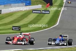 Sebastian Vettel (GER) Ferrari SF16-H and Felipe Nasr (BRA) Sauber C35. 10.07.2016. Formula 1 World Championship, Rd 10, British Grand Prix, Silverstone, England, Race Day.