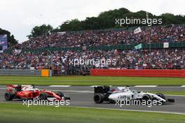 Felipe Massa (BRA) Williams FW38 leads Sebastian Vettel (GER) Ferrari SF16-H. 10.07.2016. Formula 1 World Championship, Rd 10, British Grand Prix, Silverstone, England, Race Day.