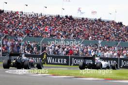 Felipe Massa (BRA) Williams FW38 leads Fernando Alonso (ESP) McLaren MP4-31. 10.07.2016. Formula 1 World Championship, Rd 10, British Grand Prix, Silverstone, England, Race Day.