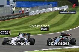 Felipe Massa (BRA) Williams FW38 and Nico Hulkenberg (GER) Sahara Force India F1 VJM09 battle for position. 10.07.2016. Formula 1 World Championship, Rd 10, British Grand Prix, Silverstone, England, Race Day.