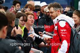 Sebastian Vettel (GER) Ferrari signs autographs for the fans. 09.07.2016. Formula 1 World Championship, Rd 10, British Grand Prix, Silverstone, England, Qualifying Day.