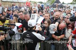 Sergio Perez (MEX) Sahara Force India F1 signs autographs for the fans at the Sahara Force India F1 Team Fan Zone at Woodlands Campsite. 09.07.2016. Formula 1 World Championship, Rd 10, British Grand Prix, Silverstone, England, Qualifying Day.