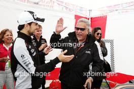 Dr. Vijay Mallya (IND) Sahara Force India F1 Team Owner and Sergio Perez (MEX) Sahara Force India F1 play Scalextric at the Sahara Force India F1 Team Fan Zone at Woodlands Campsite. 09.07.2016. Formula 1 World Championship, Rd 10, British Grand Prix, Silverstone, England, Qualifying Day.