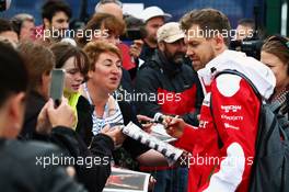 Sebastian Vettel (GER) Ferrari signs autographs for the fans. 09.07.2016. Formula 1 World Championship, Rd 10, British Grand Prix, Silverstone, England, Qualifying Day.