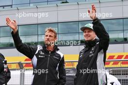 (L to R): Jenson Button (GBR) McLaren with Nico Hulkenberg (GER) Sahara Force India F1 on the drivers parade. 10.07.2016. Formula 1 World Championship, Rd 10, British Grand Prix, Silverstone, England, Race Day.