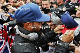 Lewis Hamilton (GBR) Mercedes AMG F1 signs autographs for the fans on the drivers parade. 10.07.2016. Formula 1 World Championship, Rd 10, British Grand Prix, Silverstone, England, Race Day.