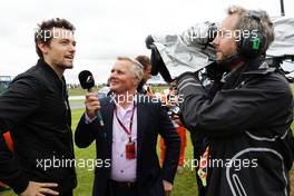 (L to R): Jolyon Palmer (GBR) Renault Sport F1 Team with Johnny Herbert (GBR) Sky Sports F1 Presenter on the drivers parade. 10.07.2016. Formula 1 World Championship, Rd 10, British Grand Prix, Silverstone, England, Race Day.