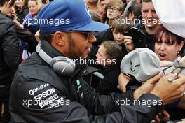 Lewis Hamilton (GBR) Mercedes AMG F1 signs autographs for the fans on the drivers parade. 10.07.2016. Formula 1 World Championship, Rd 10, British Grand Prix, Silverstone, England, Race Day.