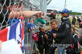 Lewis Hamilton (GBR) Mercedes AMG F1 with fans on the drivers parade. 10.07.2016. Formula 1 World Championship, Rd 10, British Grand Prix, Silverstone, England, Race Day.