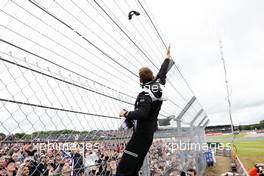 Jenson Button (GBR) McLaren with fans on the drivers parade. 10.07.2016. Formula 1 World Championship, Rd 10, British Grand Prix, Silverstone, England, Race Day.