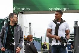 (L to R): Marc Hynes (GBR) with Anthony Joshua (GBR) Boxer.  10.07.2016. Formula 1 World Championship, Rd 10, British Grand Prix, Silverstone, England, Race Day.