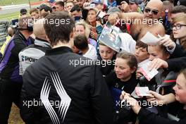 Jolyon Palmer (GBR) Renault Sport F1 Team signs autographs for the fans on the drivers parade. 10.07.2016. Formula 1 World Championship, Rd 10, British Grand Prix, Silverstone, England, Race Day.