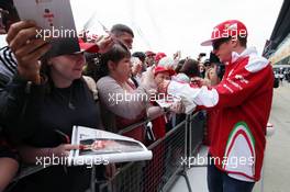 Kimi Raikkonen (FIN) Ferrari signs autographs for the fans. 07.07.2016. Formula 1 World Championship, Rd 10, British Grand Prix, Silverstone, England, Preparation Day.