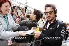 Fernando Alonso (ESP) McLaren signs autographs for the fans. 07.07.2016. Formula 1 World Championship, Rd 10, British Grand Prix, Silverstone, England, Preparation Day.