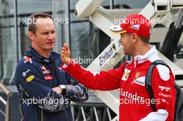 (L to R): Paul Monaghan (GBR) Red Bull Racing Chief Engineer with Sebastian Vettel (GER) Ferrari. 07.07.2016. Formula 1 World Championship, Rd 10, British Grand Prix, Silverstone, England, Preparation Day.