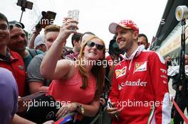 Sebastian Vettel (GER) Ferrari with fans. 07.07.2016. Formula 1 World Championship, Rd 10, British Grand Prix, Silverstone, England, Preparation Day.