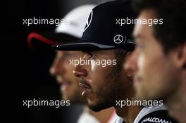 Lewis Hamilton (GBR) Mercedes AMG F1 with Jenson Button (GBR) McLaren and Jolyon Palmer (GBR) Renault Sport F1 Team in the FIA Press Conference. 07.07.2016. Formula 1 World Championship, Rd 10, British Grand Prix, Silverstone, England, Preparation Day.