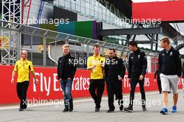 Kevin Magnussen (DEN) Renault Sport F1 Team and Esteban Ocon (FRA) Renault Sport F1 Team Test Driver walk the circuit with the team. 07.07.2016. Formula 1 World Championship, Rd 10, British Grand Prix, Silverstone, England, Preparation Day.