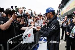 Lewis Hamilton (GBR) Mercedes AMG F1 signs autographs for the fans. 07.07.2016. Formula 1 World Championship, Rd 10, British Grand Prix, Silverstone, England, Preparation Day.