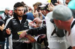 Sergio Perez (MEX) Sahara Force India F1 signs autographs for the fans. 07.07.2016. Formula 1 World Championship, Rd 10, British Grand Prix, Silverstone, England, Preparation Day.