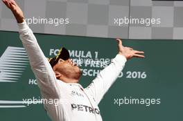 Race winner Lewis Hamilton (GBR) Mercedes AMG F1 celebrates on the podium. 31.07.2016. Formula 1 World Championship, Rd 12, German Grand Prix, Hockenheim, Germany, Race Day.