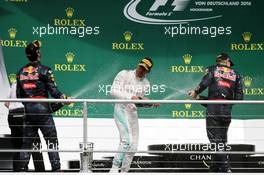 The podium (L to R): Daniel Ricciardo (AUS) Red Bull Racing, second; Lewis Hamilton (GBR) Mercedes AMG F1, race winner; Max Verstappen (NLD) Red Bull Racing, third. 31.07.2016. Formula 1 World Championship, Rd 12, German Grand Prix, Hockenheim, Germany, Race Day.