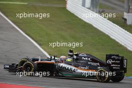 Fernando Alonso (ESP) McLaren MP4-31 and Sergio Perez (MEX) Sahara Force India F1 VJM09 battle for position. 31.07.2016. Formula 1 World Championship, Rd 12, German Grand Prix, Hockenheim, Germany, Race Day.
