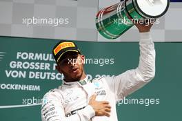 Race winner Lewis Hamilton (GBR) Mercedes AMG F1 celebrates on the podium. 31.07.2016. Formula 1 World Championship, Rd 12, German Grand Prix, Hockenheim, Germany, Race Day.